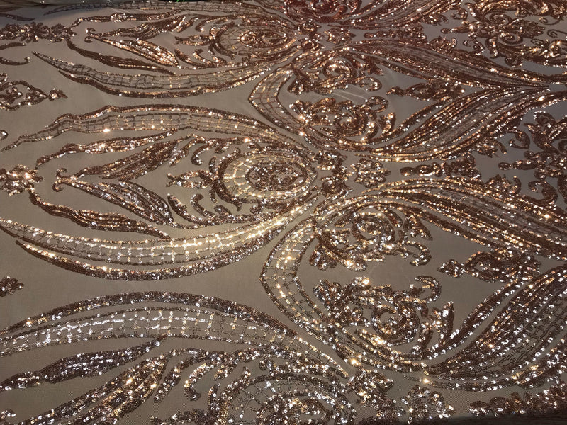 Rose gold empire design embroidered with shiny sequins on a 4 way Stretch Mesh-sold by the yard.