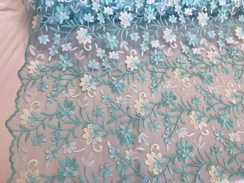 Light blue/white multi color floral design embroidery on a mesh lace-dresses-fashion-apparel-prom-nightgown-sold by the yard.