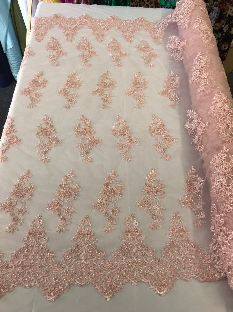 Light pink hand beaded floral design embroidery with shiny sequins on a mesh lace-dresses-apparel-fashion-prom-nightgown-sold by the yard.