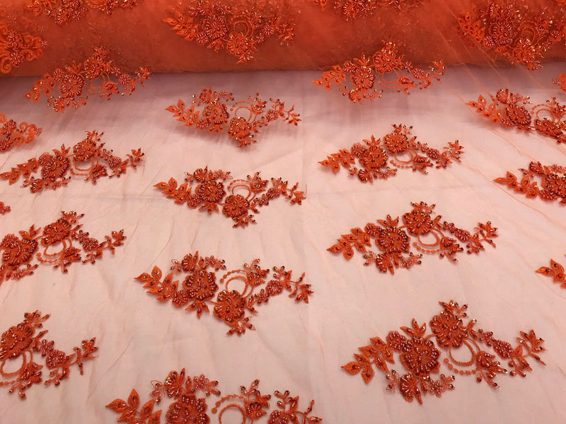 Orange hand beaded floral design embroidery with shiny sequins on a mesh lace-dresses-apparel-fashion-prom-nightgown-sold by the yard.