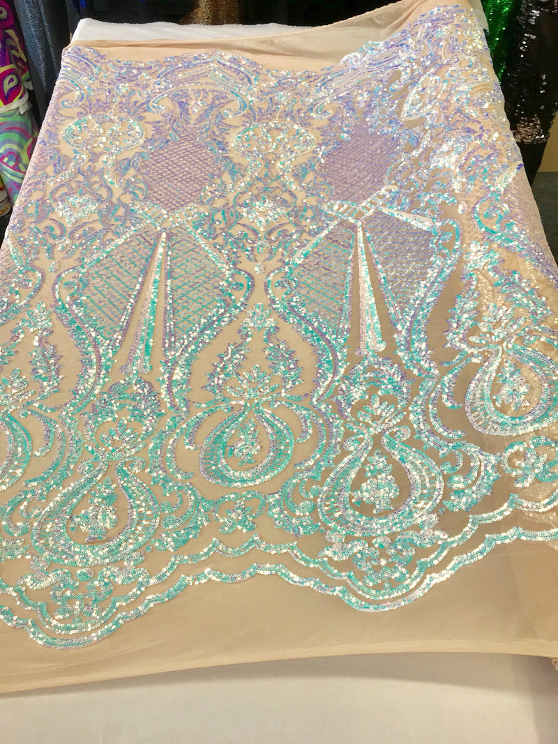 Aqua princess design iridescent sequins embroidery on a 4 way stretch nude mesh-sold by the yard.