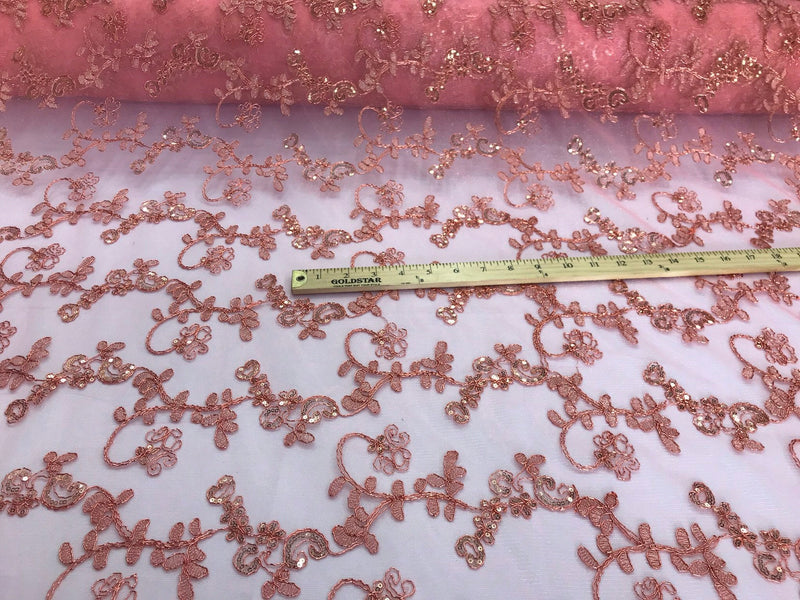 Coral metallic floral embroidery with shiny sequins and cord on a mesh lace-dresses-fashion-prom-nightgown-apparel-sold by the yard.