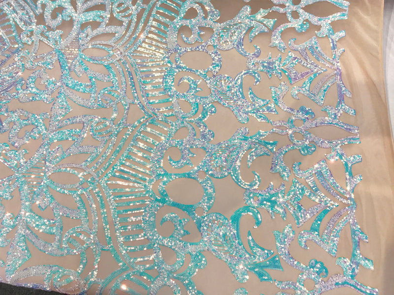 Aqua royalty iridescent sequins on a 4 way stretch nude mesh lace-dresses-apparel-fashion-prom-nightgown-sold by the yard.