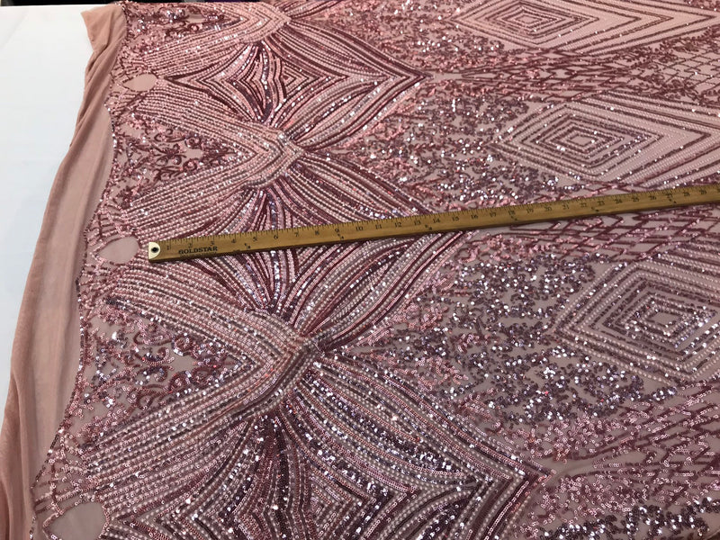 Dusty rose Sequin diamond design embroidery on a 4 way stretch mesh-sold by the yard.