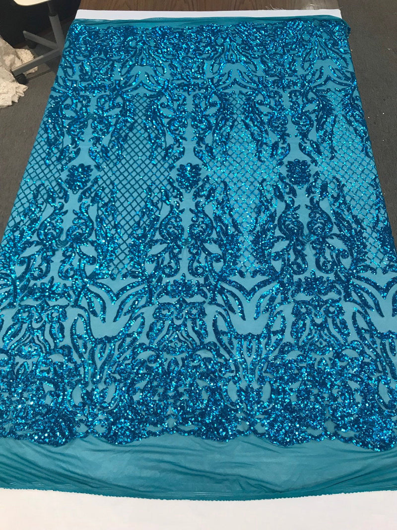 Turquoise shiny sequin damask design embroidery on a 4 way stretch mesh-dresses-prom-nightgown-sold by yard-free shipping.