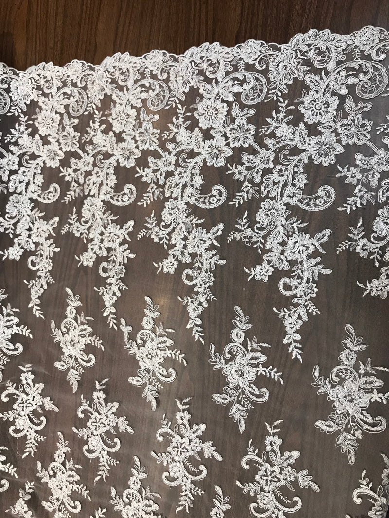 White floral design embroidery with shiny  sequins on a mesh lace-dresses-fashion-apparel-prom-nightgown-sold by the yard.