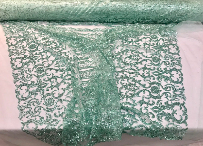 Aqua shiny glitter damask design on a mesh lace-dresses-fashion-apparel-prom-nightgown-decorations-sold by the yard.