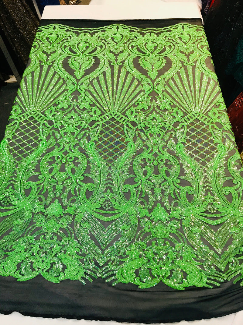 Neon green iridescent shiny sequin damask design on a black 4 way stretch mesh-sold by the yard.