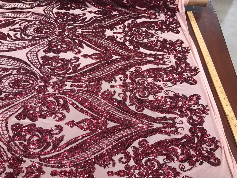 Burgundy big damask sequin design on a nude 4 way stretch mesh-sold by the yard.
