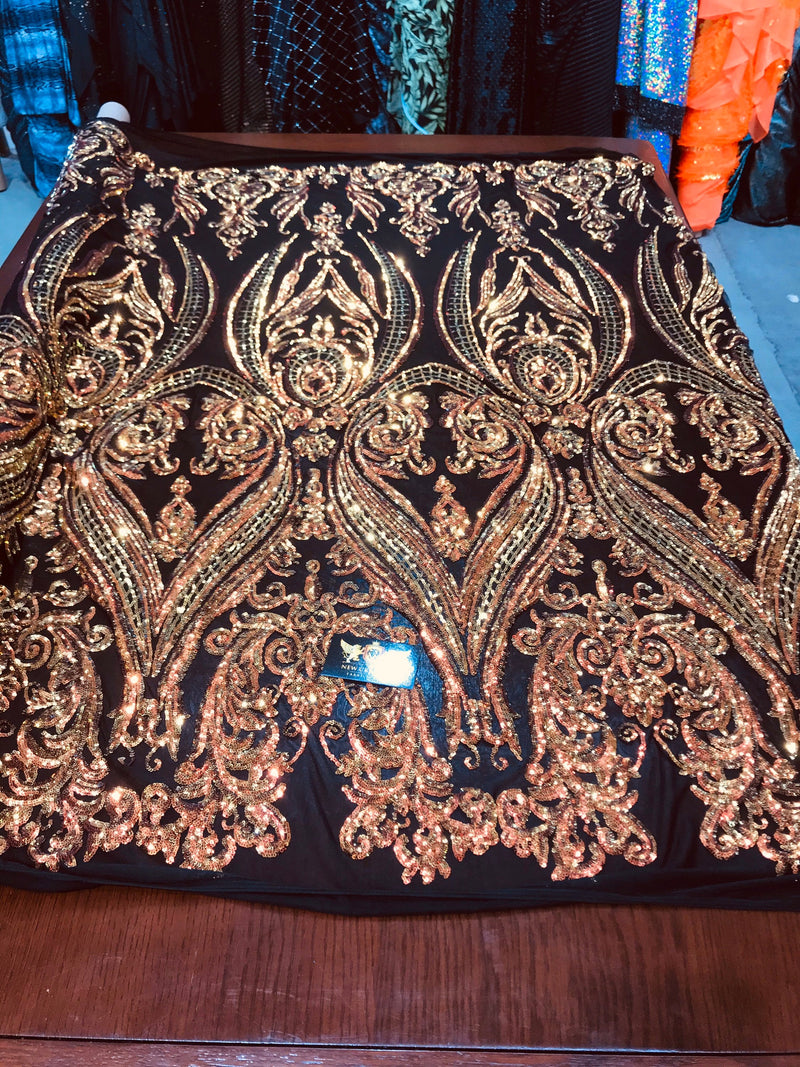 Orange iridescent big damask sequin design on a black 4 way stretch mesh-sold by the yard.