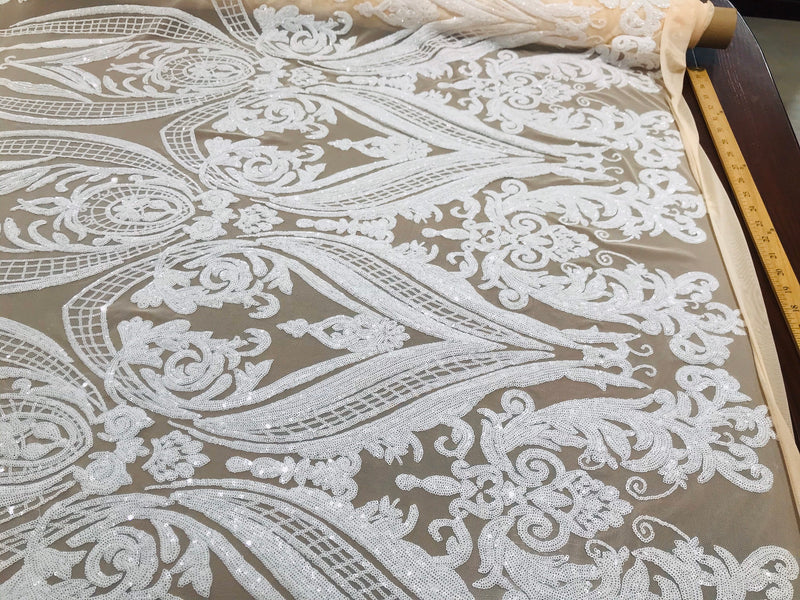 White big damask sequin design on a ivory 4 way stretch mesh-sold by the yard.