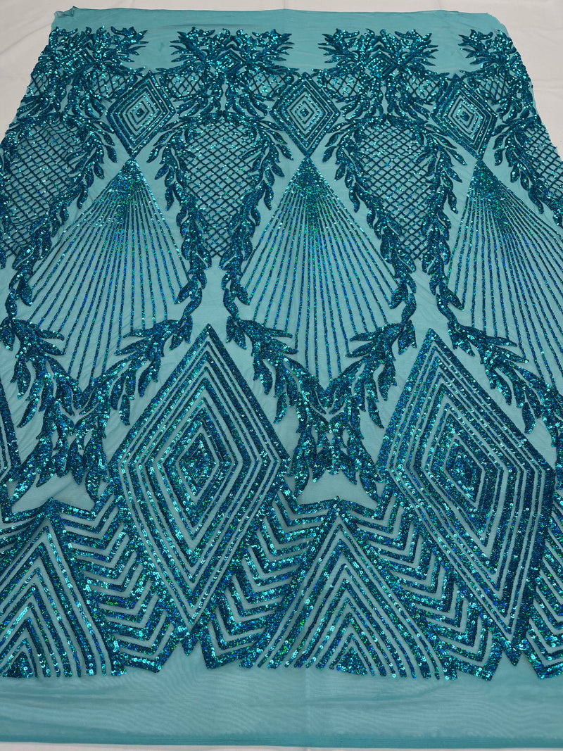 Turquoise diamond design with shiny iridescent sequins on a 4 way stretch mesh-sold by the yard.