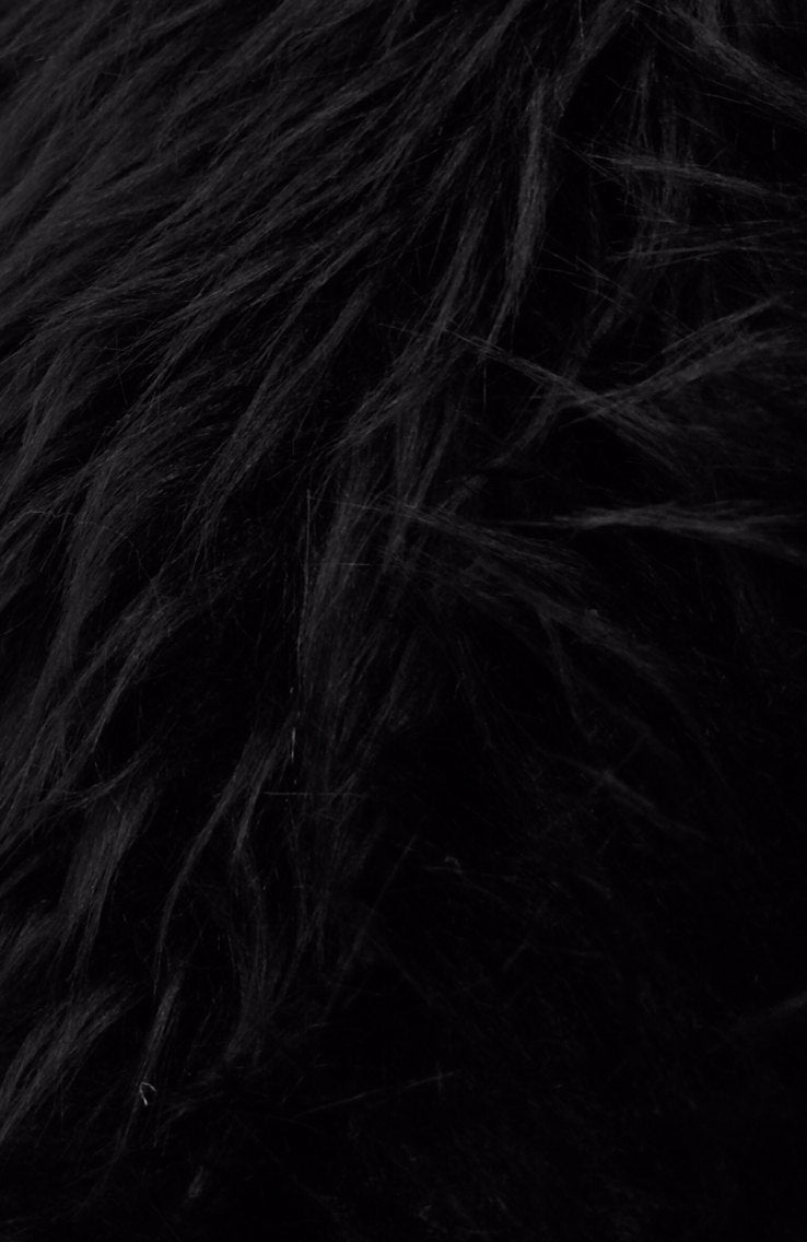 Black shaggy fake fur. Sold by the yard.36x60 inches.