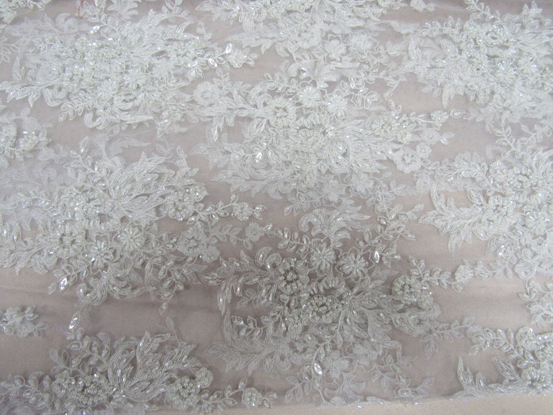 Gorgeous white French design embroider and beaded on a mesh lace. Wedding/Bridal/Prom/Nightgown fabric.