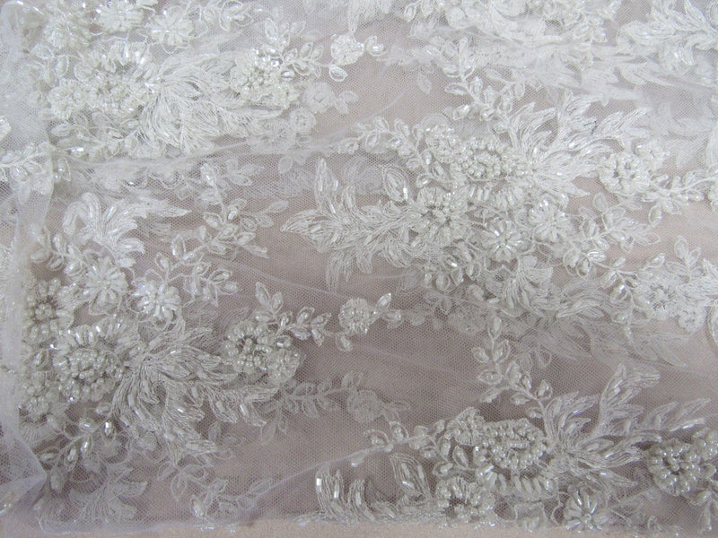 Gorgeous white French design embroider and beaded on a mesh lace. Wedding/Bridal/Prom/Nightgown fabric.