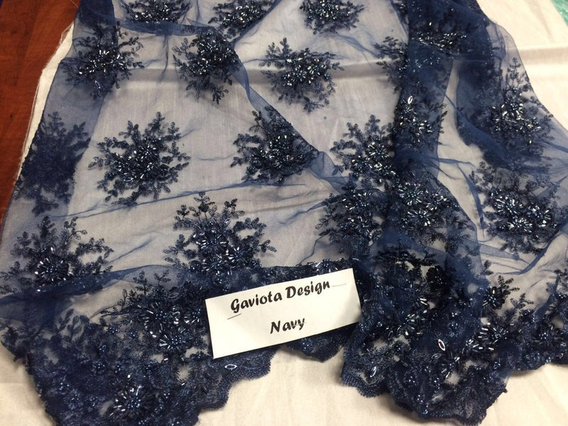 Navy blue gaviota design embroider and beaded on a mesh lace. Wedding/Bridal/Nightgown/Prom fabric. Sold by the yard.