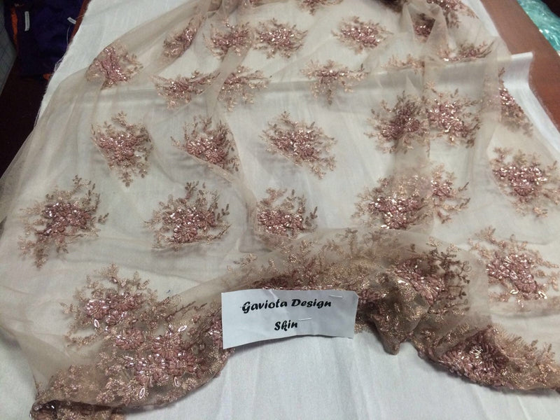 Skin color gaviota design embroider and beaded on a mesh lace. Wedding/Bridal/Prom/Nightgown fabric. Sold by the yard.