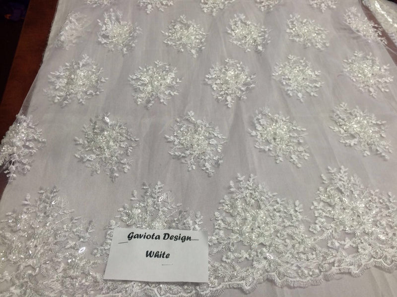Offwhite gaviota design embroider and beaded on a mesh lace. Wedding/Bridal/Prom/Nightgown fabric. Sold by the yard.