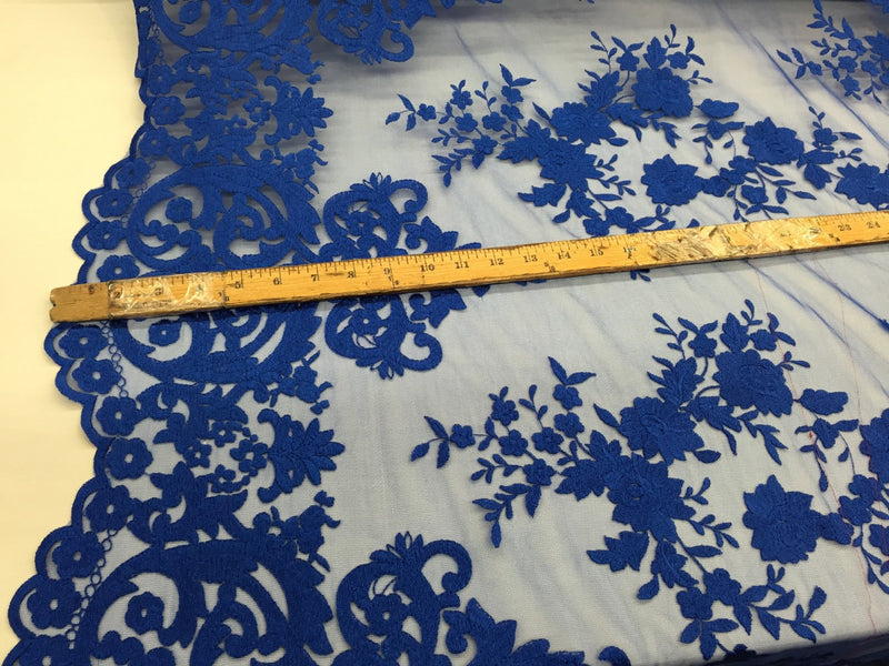 Royal blue flowers embroider on a 2 way stretch medh lace. Wedding/Prom/Bridal/Nightgown fabric. Sold by the yard.