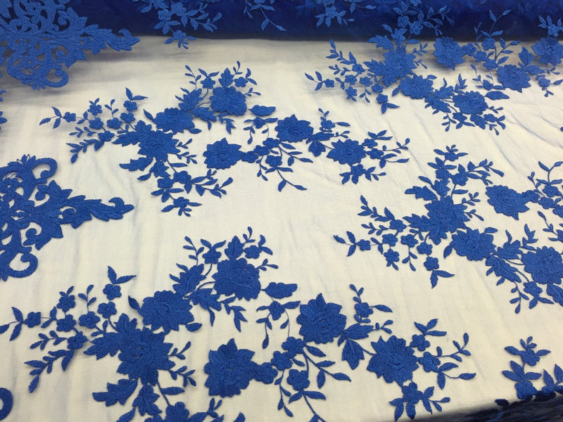 Royal blue flowers embroider on a 2 way stretch medh lace. Wedding/Prom/Bridal/Nightgown fabric. Sold by the yard.