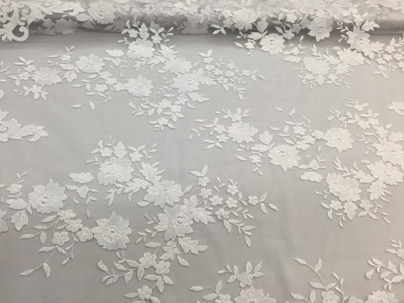White flowers embroider on a 2 way stretch mesh lace. Wedding/Bridal/Prom/Nightgown fabric-apparel-fashion-dresses-Sold by the yard.