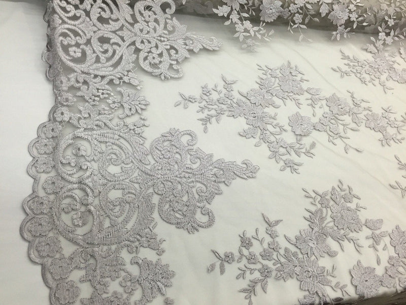 Silver/gray flowers embroider on a 2 way stretch mesh lace. Wedding/Bridal/Prom/Nightgown fabric-apparel-dresses-fashion-Sold by the yard.