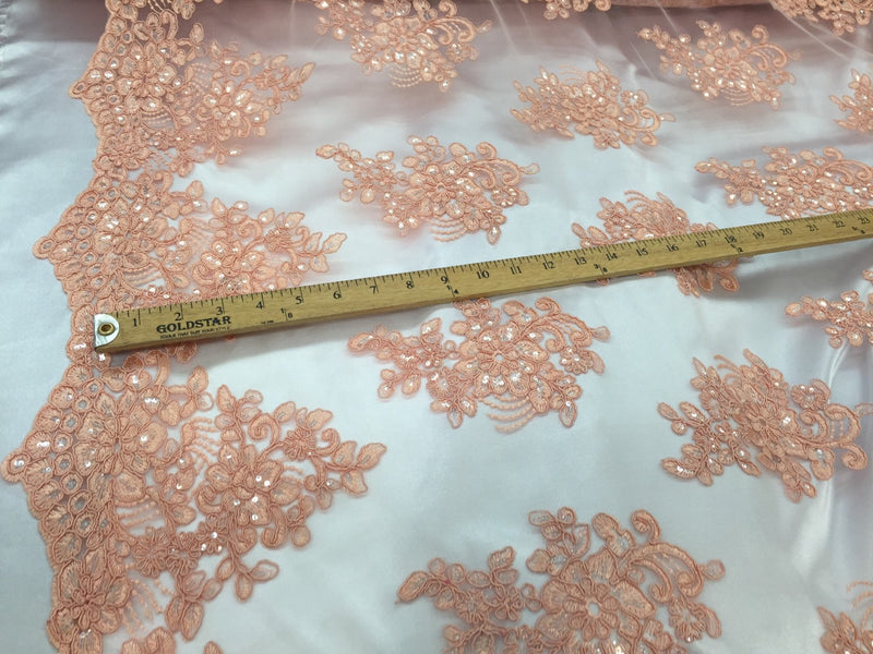 Peach flower lace corded and embroider with sequins on a mesh.wedding/bridal/prom/nightgown fabric. Sold by the yard.