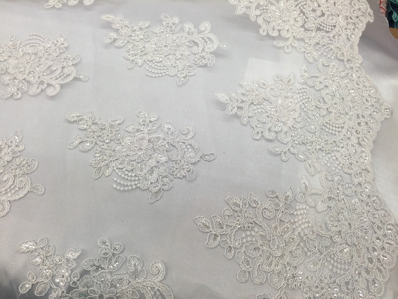 White flower lace corded and embroider with sequins on a mesh. Wedding/bridal/prom/nightgown fabric. Sold by the yard.