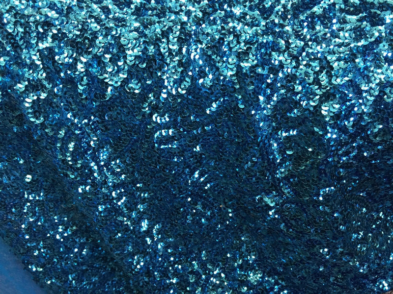 Turquoise mermaid fish scales sequins- seaweed sequins design- sold by the yard.58" wide.