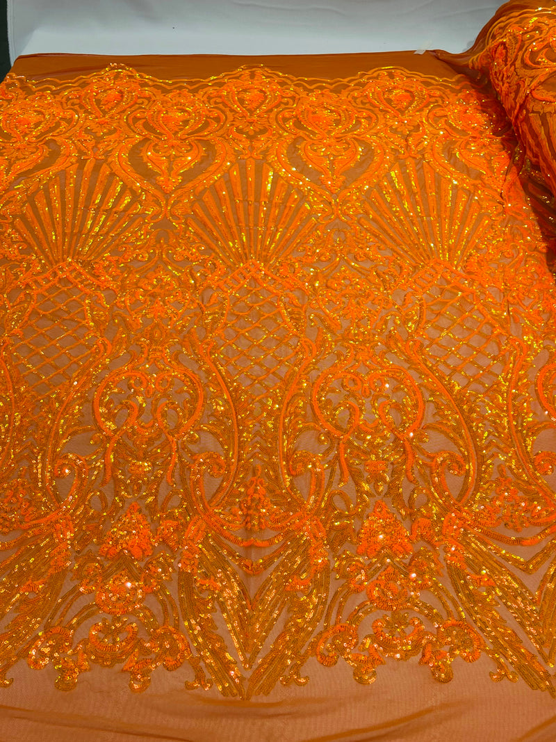 Orange iridescent sequin damask design on a 4 way stretch mesh- sold by the yard.