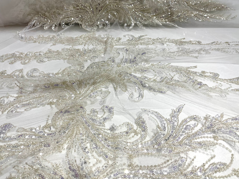 Off White heavy hand beaded design embroider with beads-pearls-sequins on a mesh lace-sold by yard.