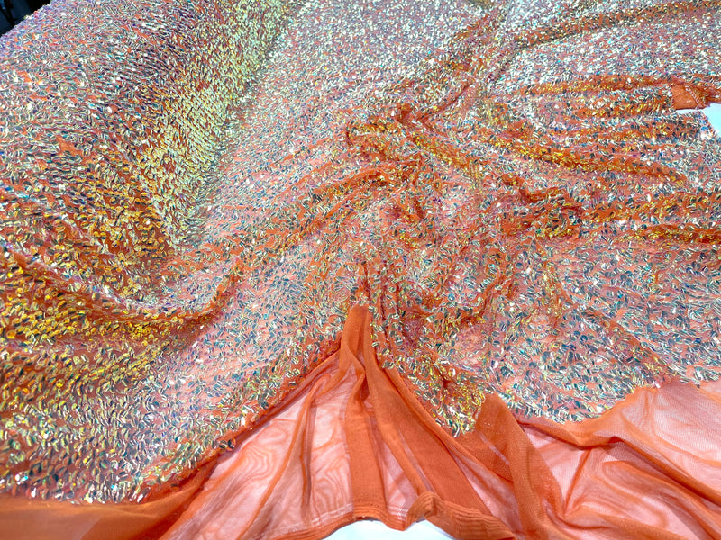 Aqua Clear iridescent mini round paillette sequins on a orange stretch mesh, sold by the yard.
