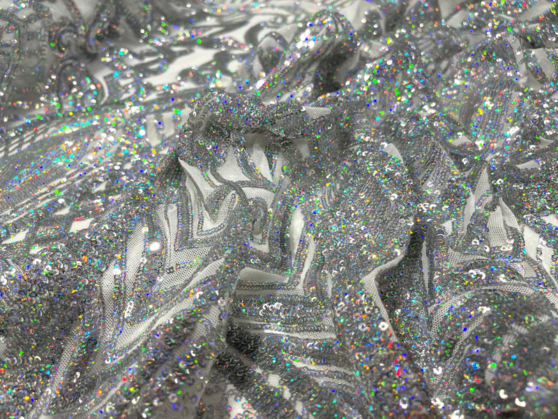Silver iridescent royalty design on a white 4 way stretch mesh-prom-sold by the yard.