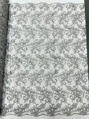 Estrella corded flowers embroider with sequins on a mesh lace fabric-sold by the yard.