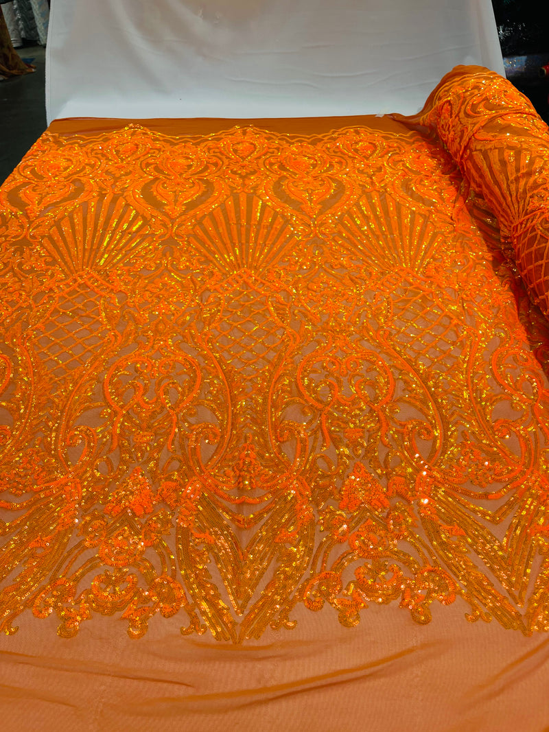 Orange iridescent sequin damask design on a 4 way stretch mesh- sold by the yard.