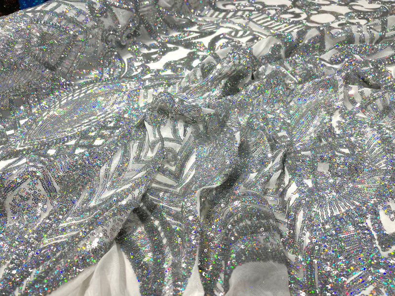 Silver iridescent royalty design on a white 4 way stretch mesh-prom-sold by the yard.