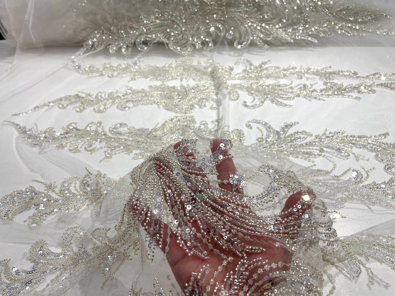 Off White heavy hand beaded design embroider with beads-pearls-sequins on a mesh lace-sold by yard.
