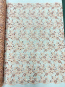 Estrella corded flowers embroider with sequins on a mesh lace fabric-sold by the yard.