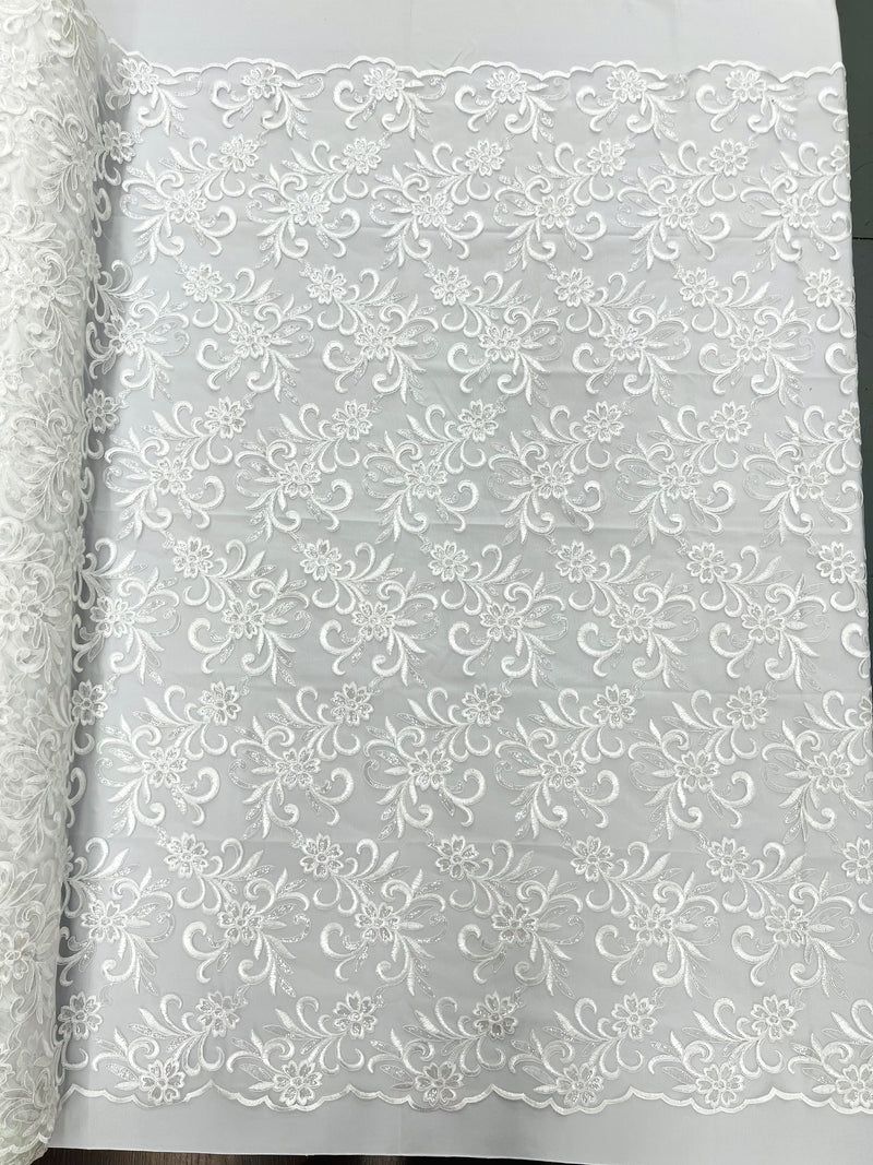 Estrella corded flowers embroider with sequins on a mesh lace fabric-sold by the yard.