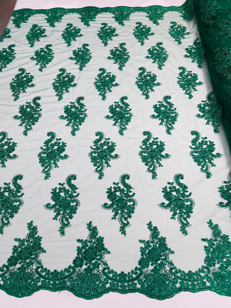 Hunter green metallic floral design embroidery on a mesh lace with sequins and cord-sold by the yard.
