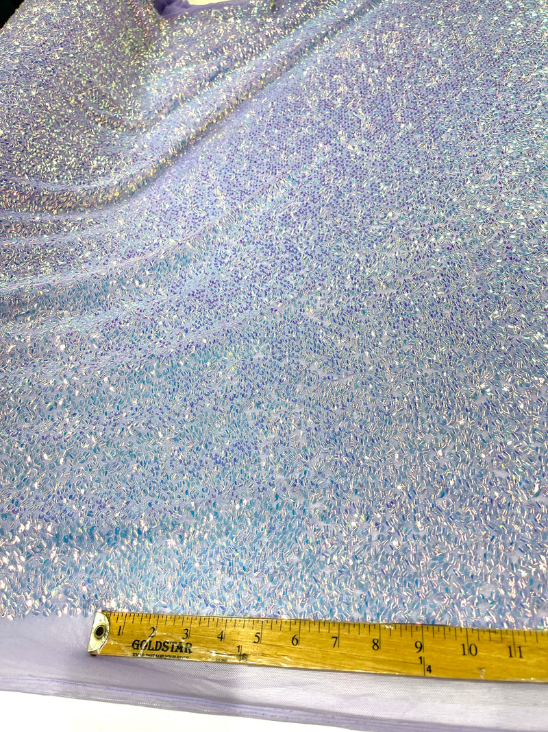Aqua Clear iridescent mini round paillette sequins on a lavender stretch mesh, sold by the yard.