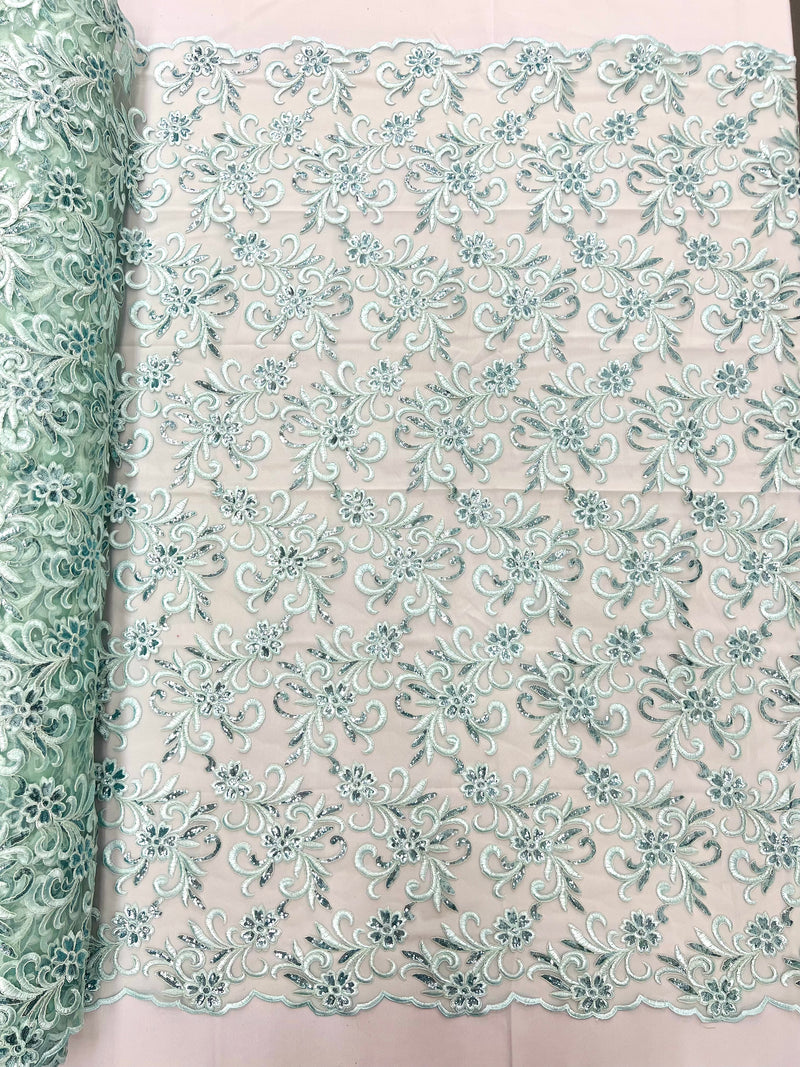 Estrella corded flowers embroider with sequins on a mesh lace fabric-sold by the yard.