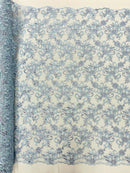 Estrella corded flowers embroider with sequins on a mesh lace fabric-sold by the yard.