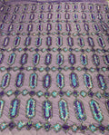 Iridescent Jewel sequin design on a black 4 way stretch mesh fabric -sold by the yard.