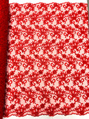 Estrella corded flowers embroider with sequins on a mesh lace fabric-sold by the yard.