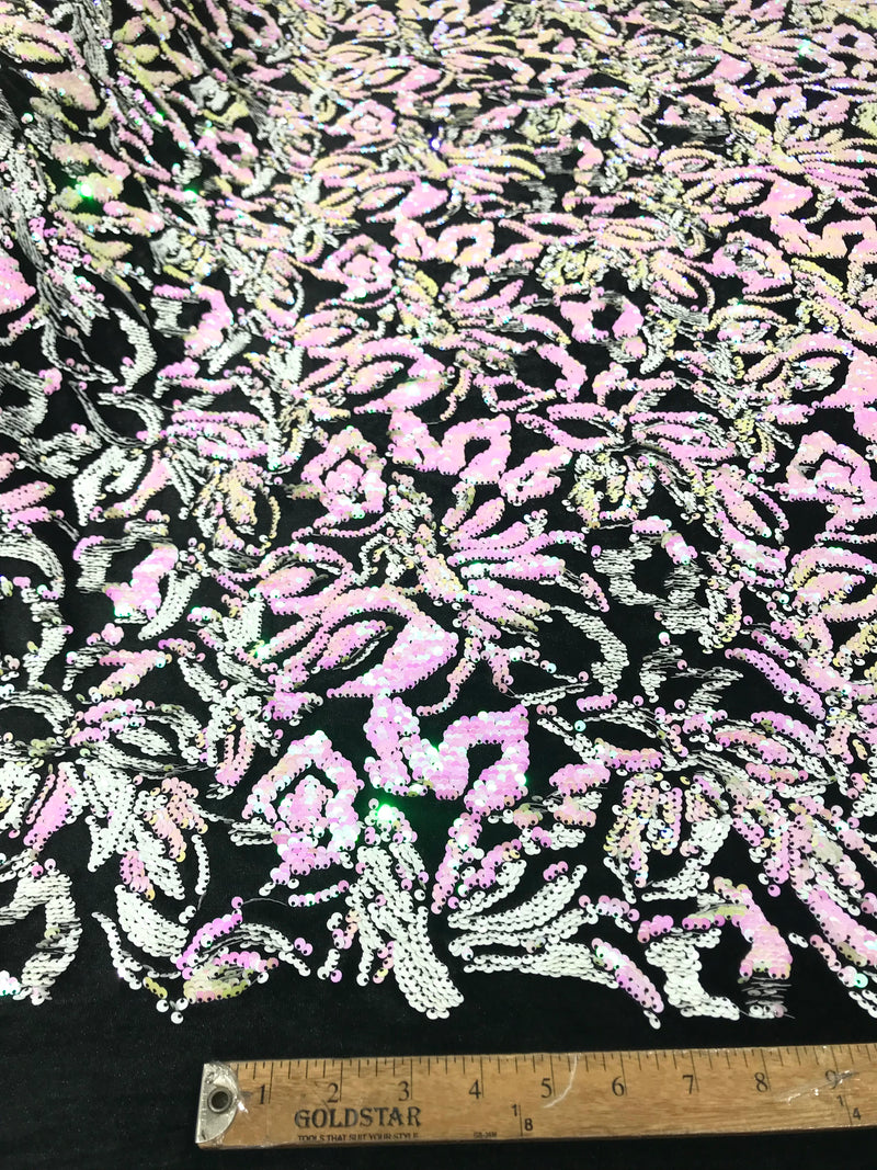 Pink, white iridescent sequins flip two tone floral design on a black stretch velvet, Sold by the yard.