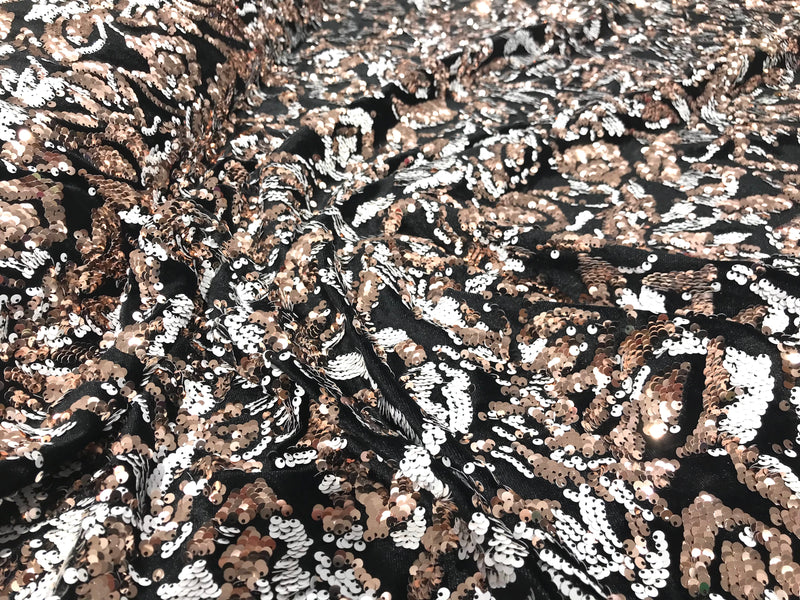 Rose gold, white sequins flip two tone floral design on a black stretch velvet, Sold by the yard.