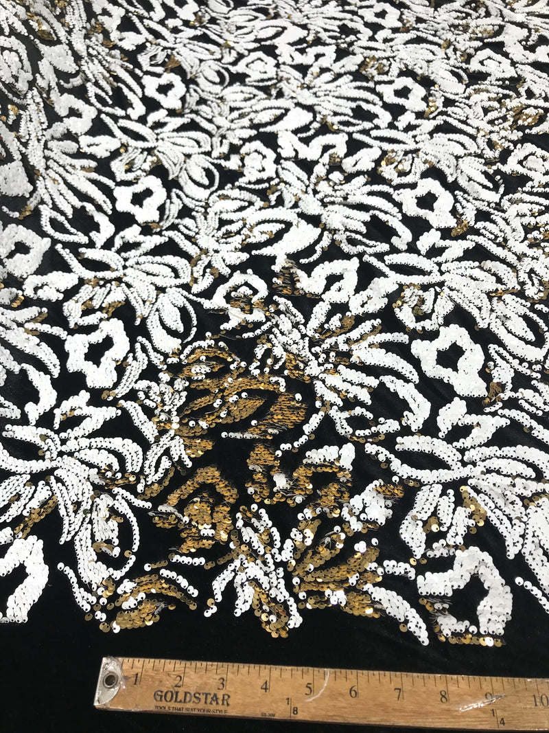 White/gold sequins flip two tone floral design on a black stretch velvet, Sold by the yard.